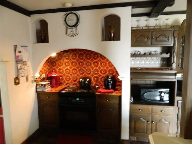 kitchen with backsplash and black range with electric cooktop