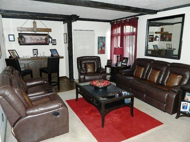 living room with beam ceiling and a textured ceiling