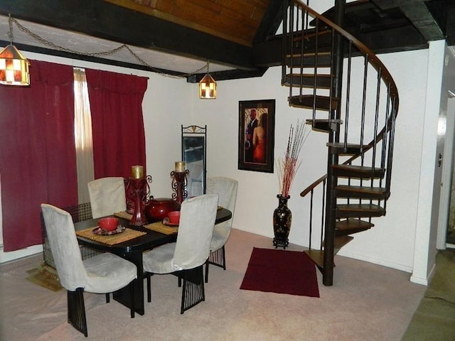 dining area with wood ceiling, lofted ceiling with beams, and carpet