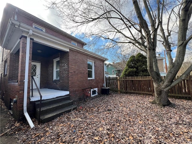 view of side of home featuring cooling unit