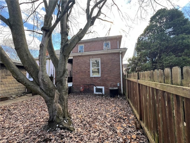 view of side of home featuring central air condition unit