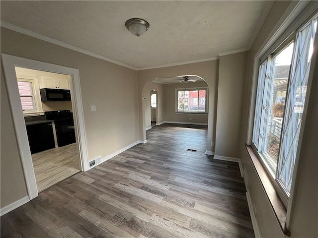 foyer with dark wood-type flooring and ornamental molding