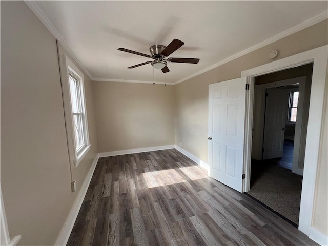 unfurnished room featuring crown molding, ceiling fan, and dark hardwood / wood-style flooring