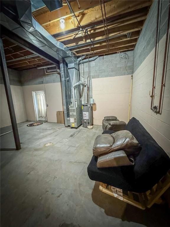 716-718 Hettie Way, City Of But Sw, PA 16001 - unfinished below grade area with water heater, heating unit, and concrete block wall
