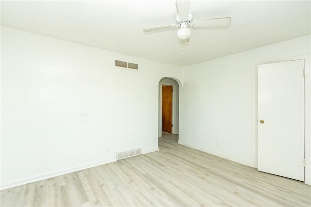 empty room with ceiling fan and light wood-type flooring