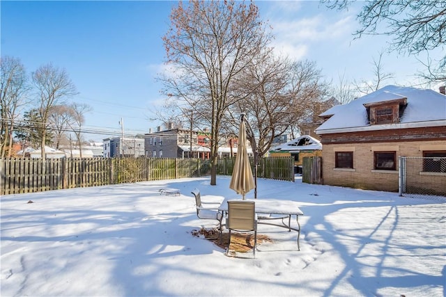 view of yard covered in snow