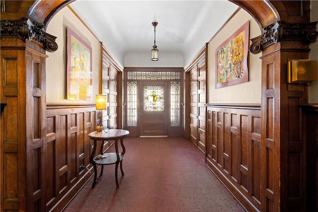 view of carpeted foyer entrance