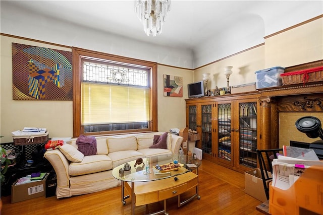 living room featuring hardwood / wood-style flooring and a chandelier