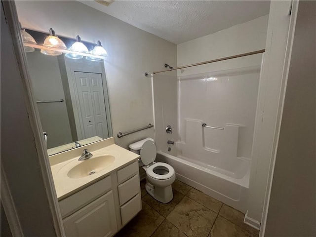 full bathroom with vanity, shower / tub combination, toilet, and a textured ceiling