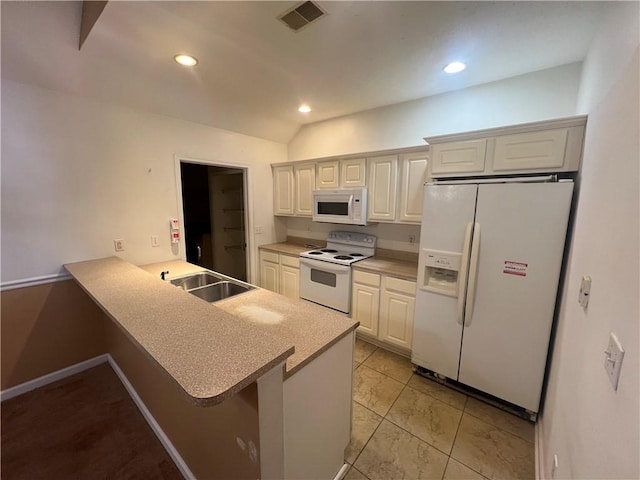 kitchen with a breakfast bar, sink, white cabinets, kitchen peninsula, and white appliances