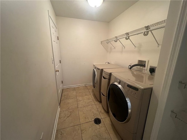 laundry area featuring washing machine and dryer