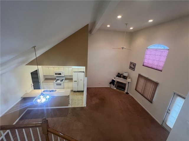 carpeted living room with beamed ceiling, ceiling fan, and high vaulted ceiling