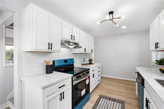 kitchen featuring white cabinetry, backsplash, light stone counters, and stainless steel appliances