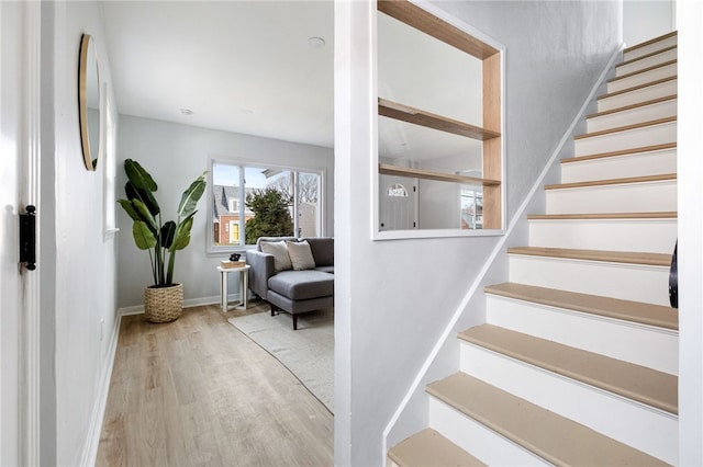 staircase featuring hardwood / wood-style flooring