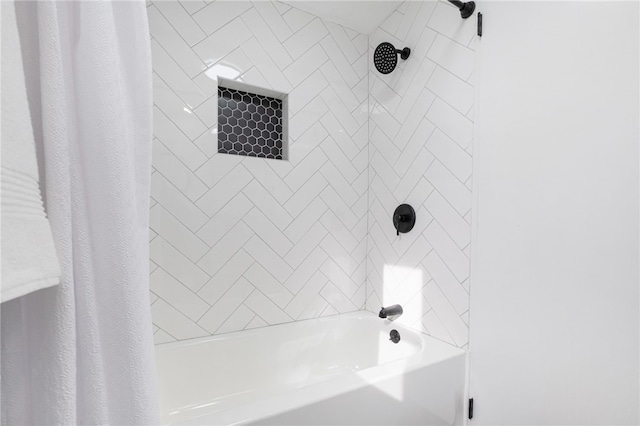 bathroom with shower / tub combo with curtain
