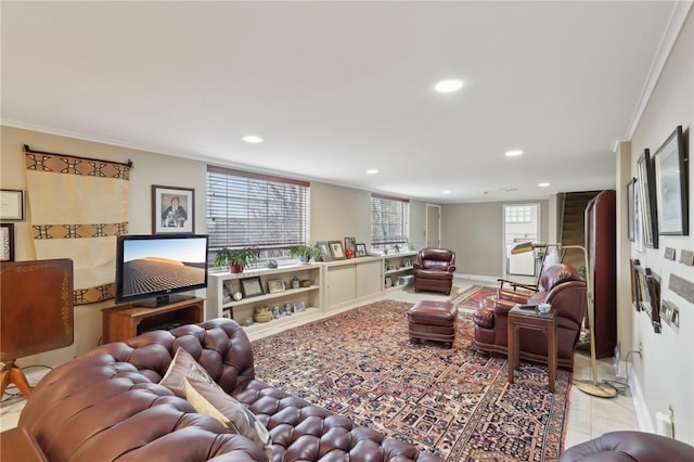 living room featuring crown molding and light tile patterned flooring