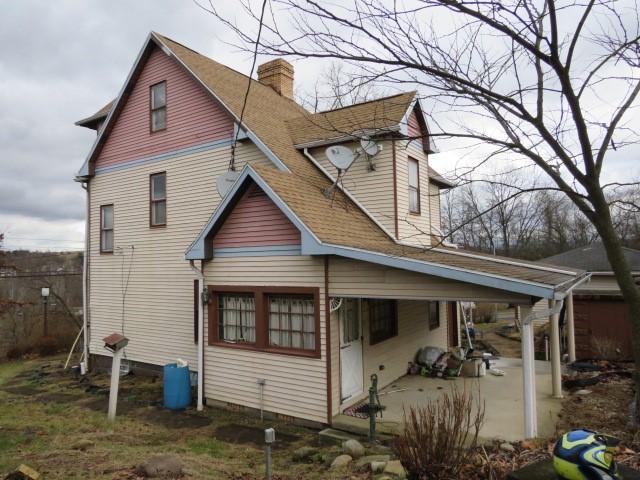 rear view of property featuring a patio