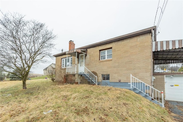 rear view of house with a yard