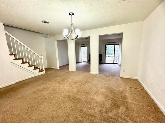 interior space with carpet, a textured ceiling, and an inviting chandelier