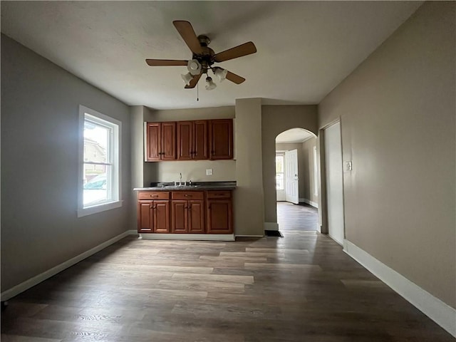 kitchen featuring ceiling fan and light hardwood / wood-style floors