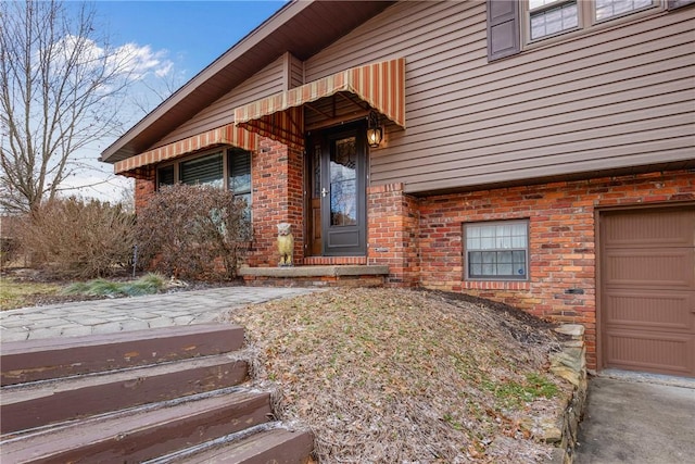 property entrance with a garage