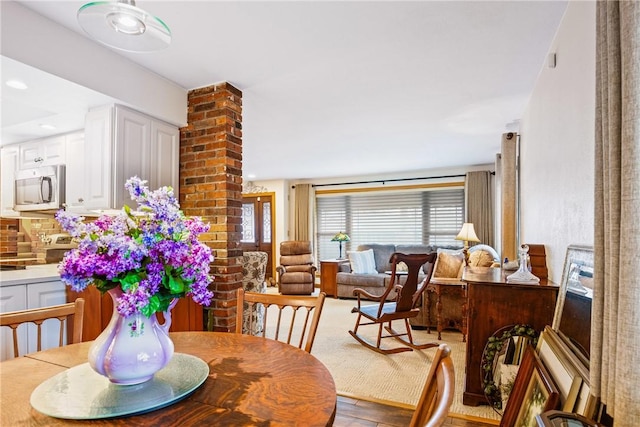 dining space with light hardwood / wood-style flooring