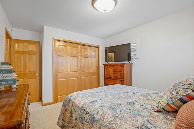 carpeted bedroom with a closet