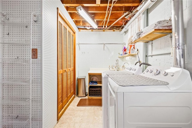 clothes washing area featuring washer / clothes dryer