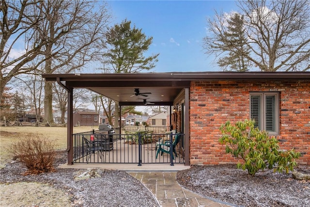 exterior space with ceiling fan