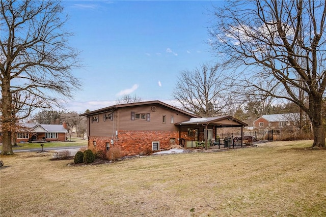 view of side of home featuring a yard