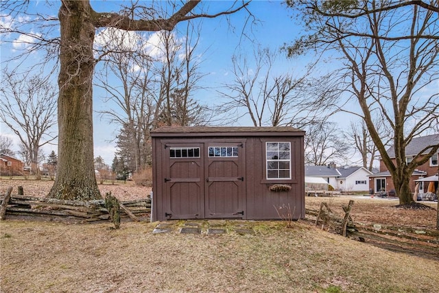 view of outdoor structure featuring a lawn