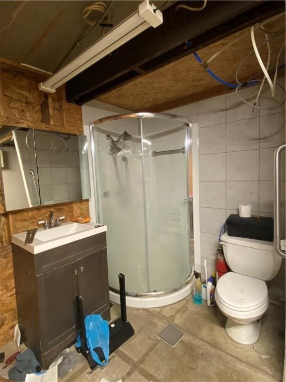 bathroom featuring vanity, concrete flooring, toilet, and walk in shower