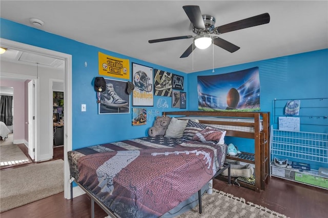 bedroom with ceiling fan and hardwood / wood-style floors