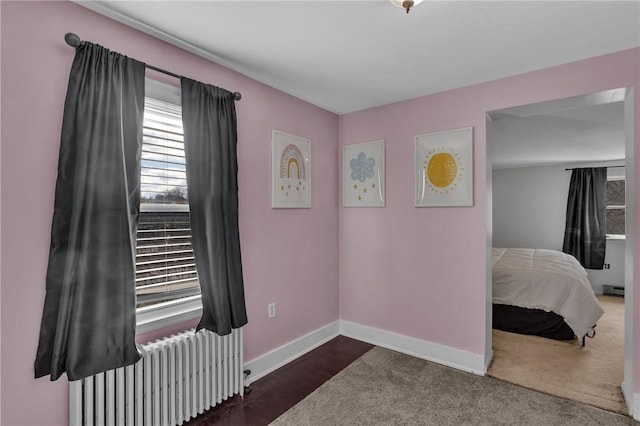 bedroom featuring radiator