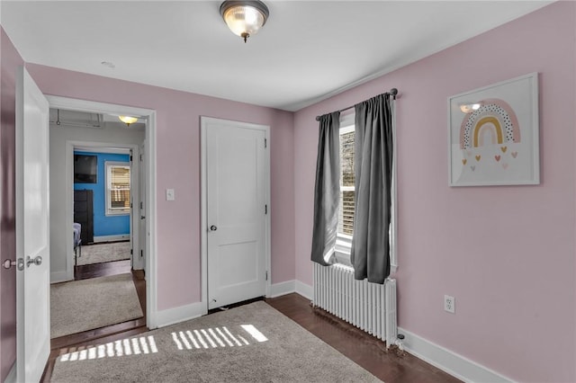 bedroom featuring radiator heating unit