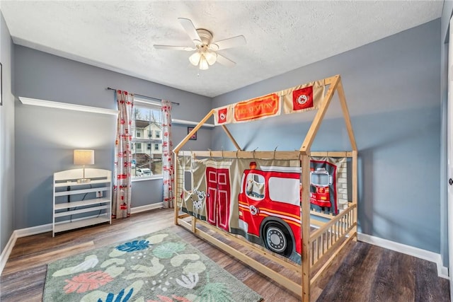 530 Peregrine Dr, North Huntingdon, PA 15642 - bedroom with ceiling fan, wood finished floors, baseboards, and a textured ceiling