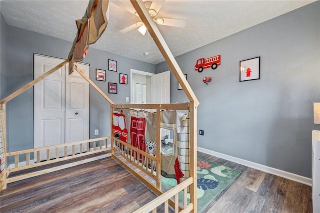 530 Peregrine Dr, North Huntingdon, PA 15642 - bedroom featuring a ceiling fan, wood finished floors, baseboards, and a textured ceiling