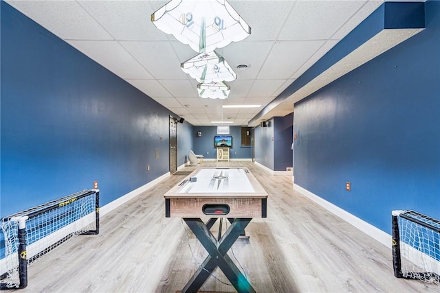 530 Peregrine Dr, North Huntingdon, PA 15642 - rec room with a drop ceiling, baseboards, and wood finished floors