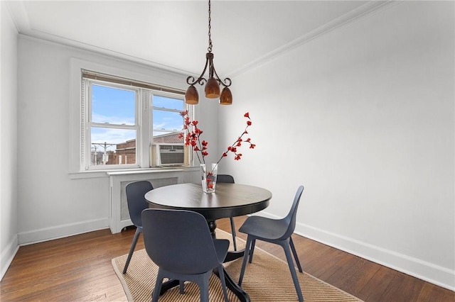 dining area featuring crown molding, hardwood / wood-style floors, and cooling unit