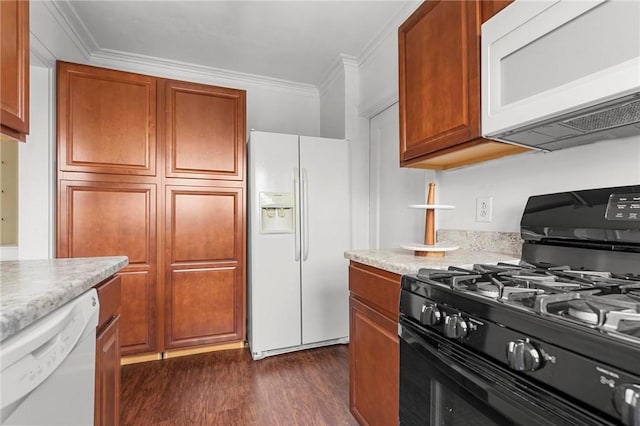 kitchen featuring ornamental molding, dark hardwood / wood-style flooring, and white appliances