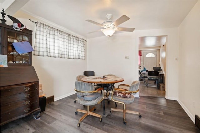 dining space with dark hardwood / wood-style floors and ceiling fan