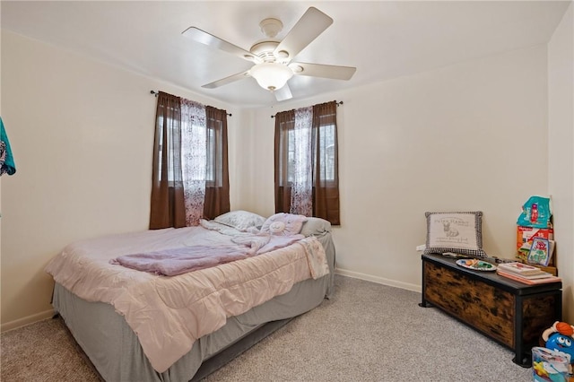 bedroom featuring ceiling fan and light colored carpet