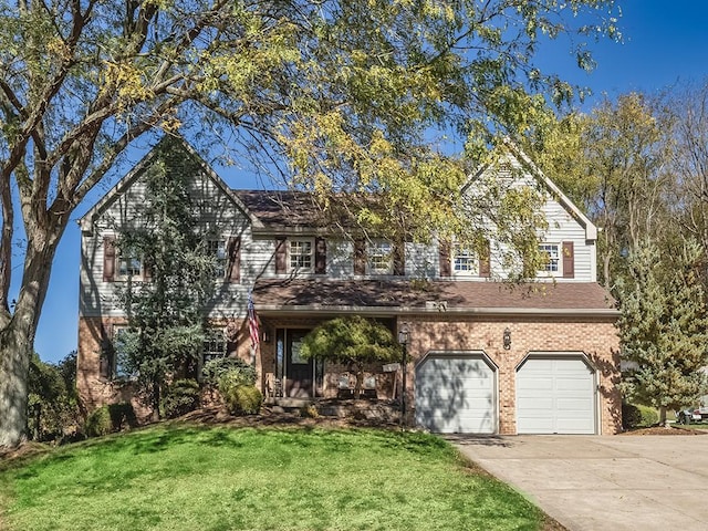 view of front of home with a garage and a front lawn