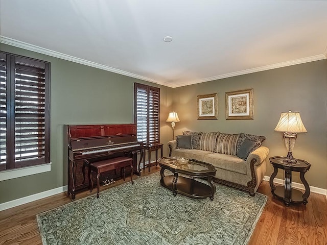 living room featuring hardwood / wood-style flooring and crown molding