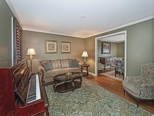 living room with crown molding and hardwood / wood-style flooring