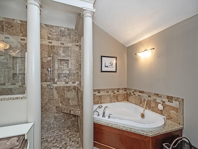 bathroom featuring lofted ceiling, independent shower and bath, a textured ceiling, and ornate columns