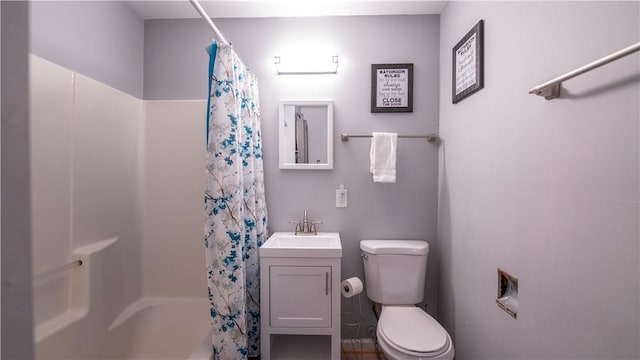 full bath featuring shower / tub combo, vanity, and toilet