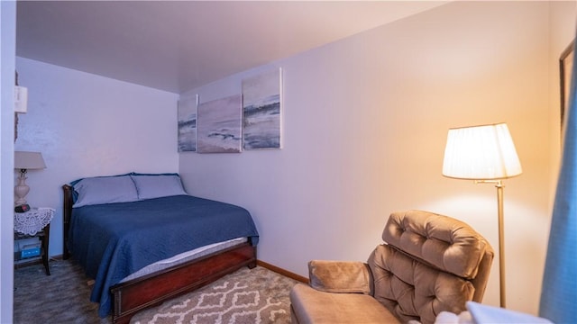 bedroom featuring carpet floors and baseboards