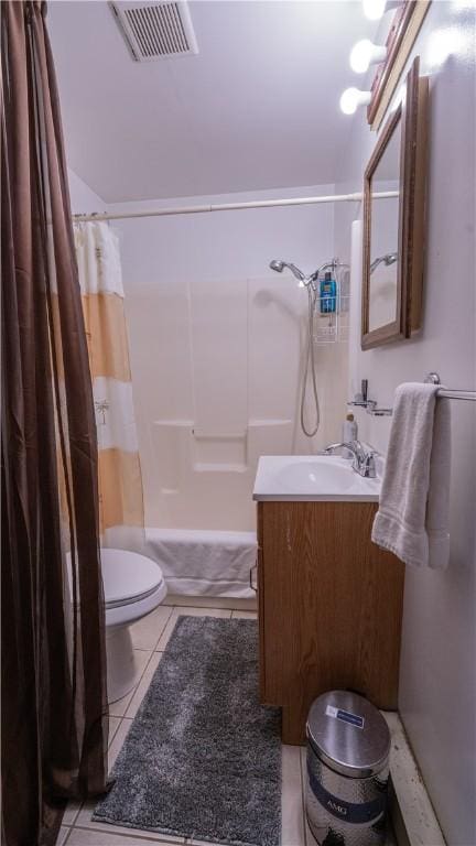 full bathroom featuring tile patterned flooring, toilet, vanity, visible vents, and shower / bath combo with shower curtain