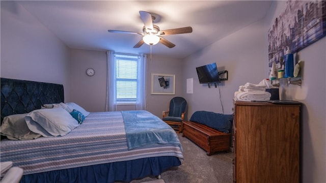 bedroom featuring ceiling fan and carpet